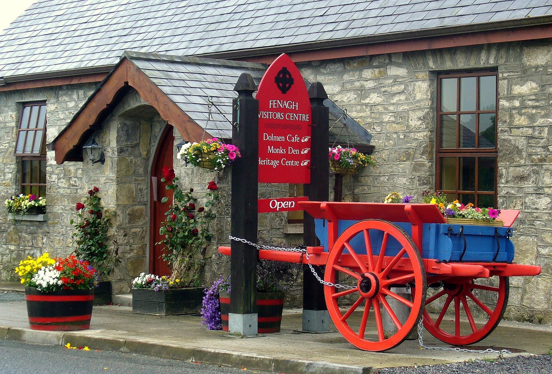 A red and blue painted horse cart outside the Fenagh Visitor Centre