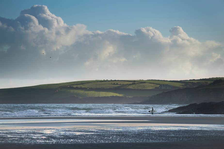 A surfer on Inchydoney Beach in West Cork