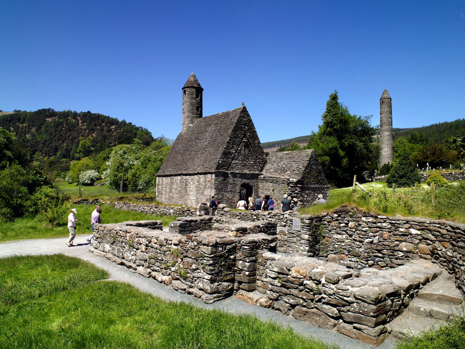People visiting the ruins of the church on St Kevin's Pilgrim Path in Glendalough, Co Wicklow
