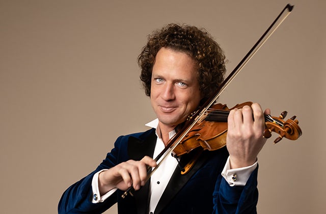 Violinist Vladimir Jablokov, a smiling man playing a violin