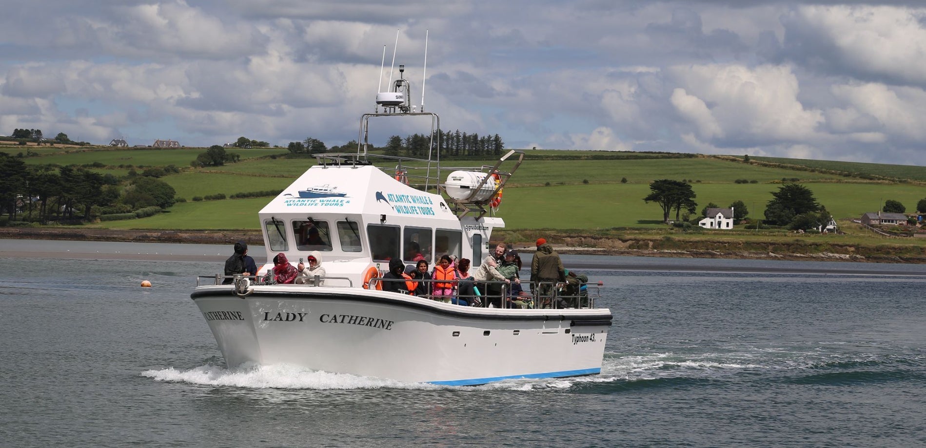 A fishing vessel at sea carrying passengers