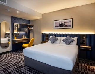 Bedroom with yellow chair.