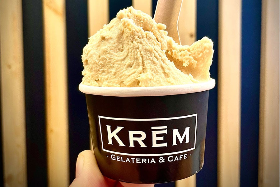A cup with spoon of Krem hazelnut gelato at Krem Gelateria and Café