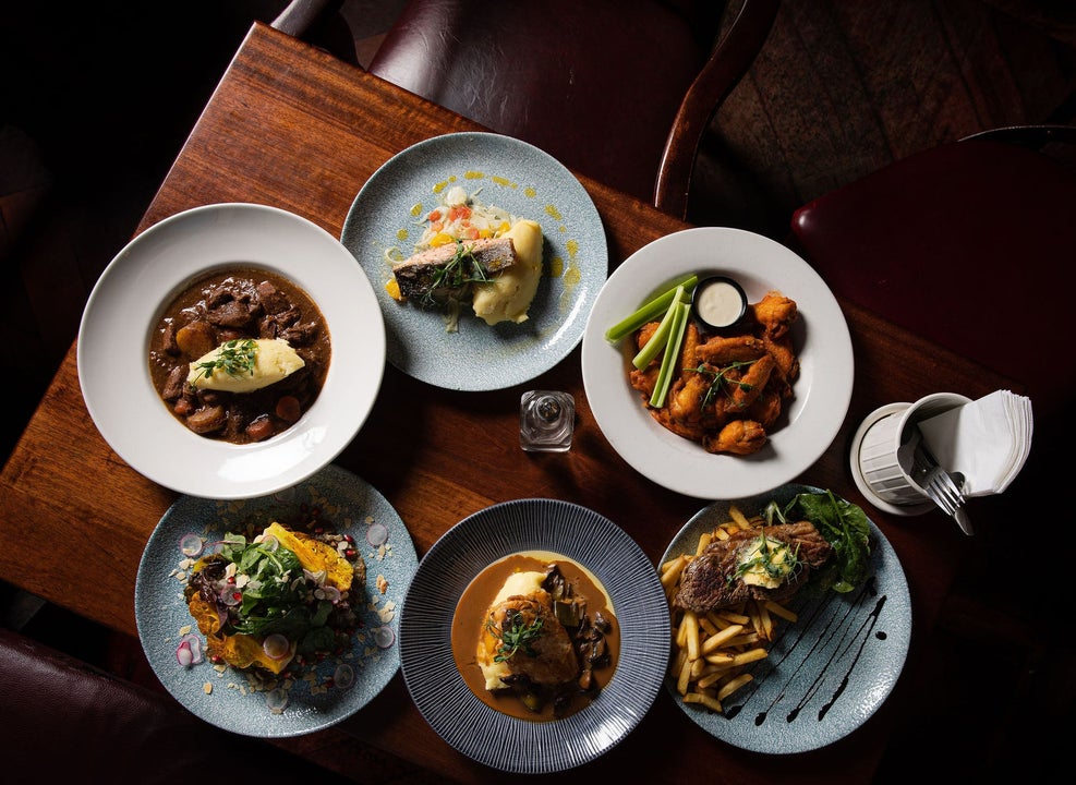 A selection of main courses on a table served at Nancy Hands Bar & Restaurant