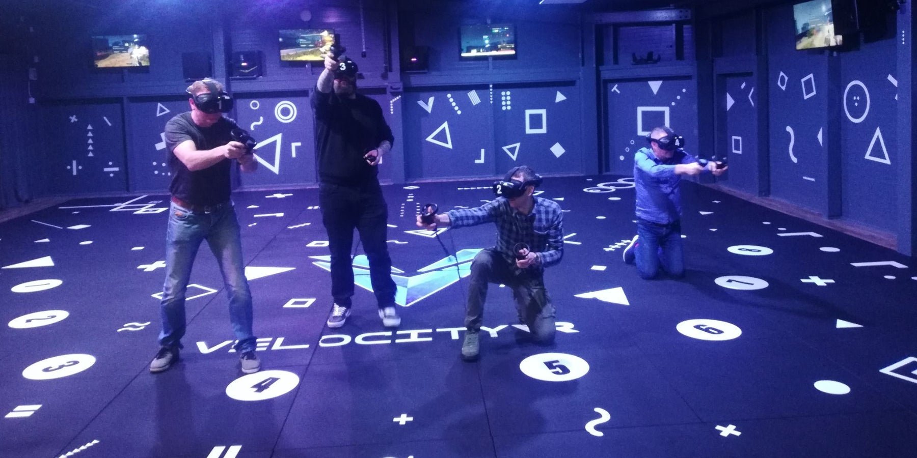 People participating in a Velocity Virtual Reality escape room
