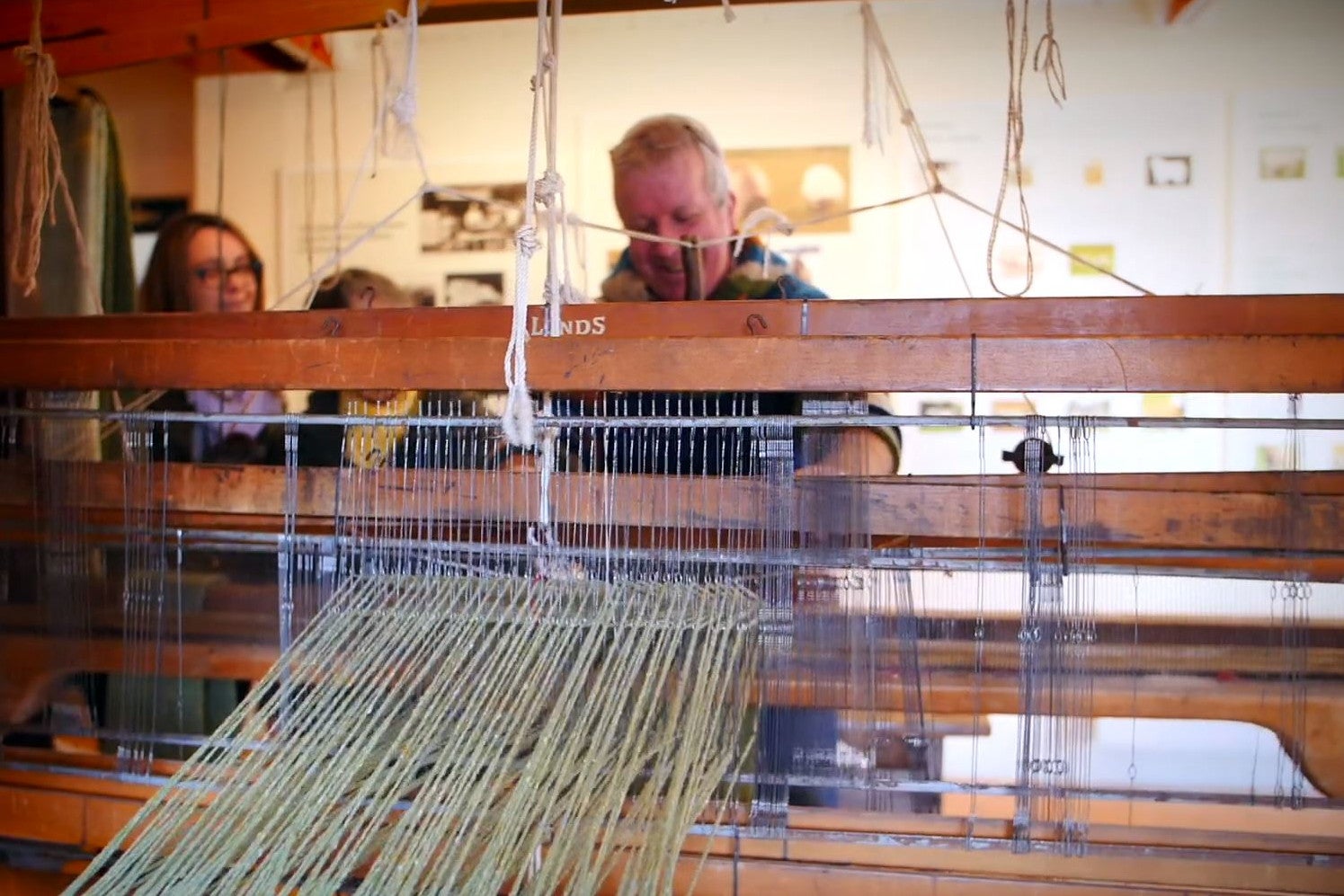 Demonstrator at loom