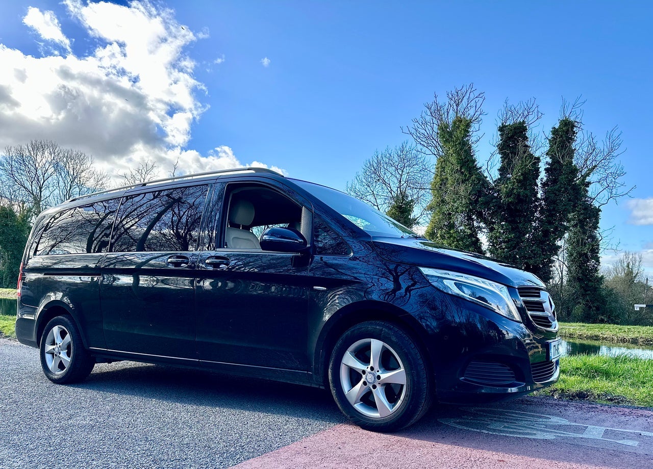 Black Mercedes tour bus
