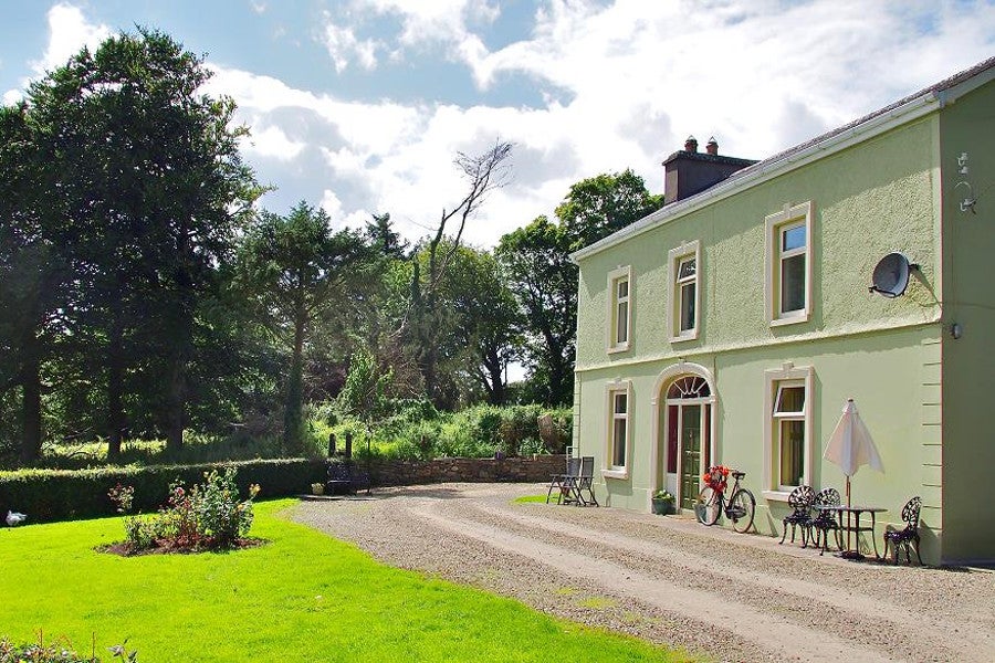 Front view of property with seating area