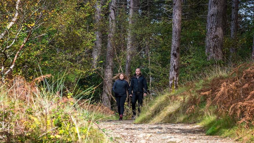 A couple walking in Ards Forest Park in Co Donegal
