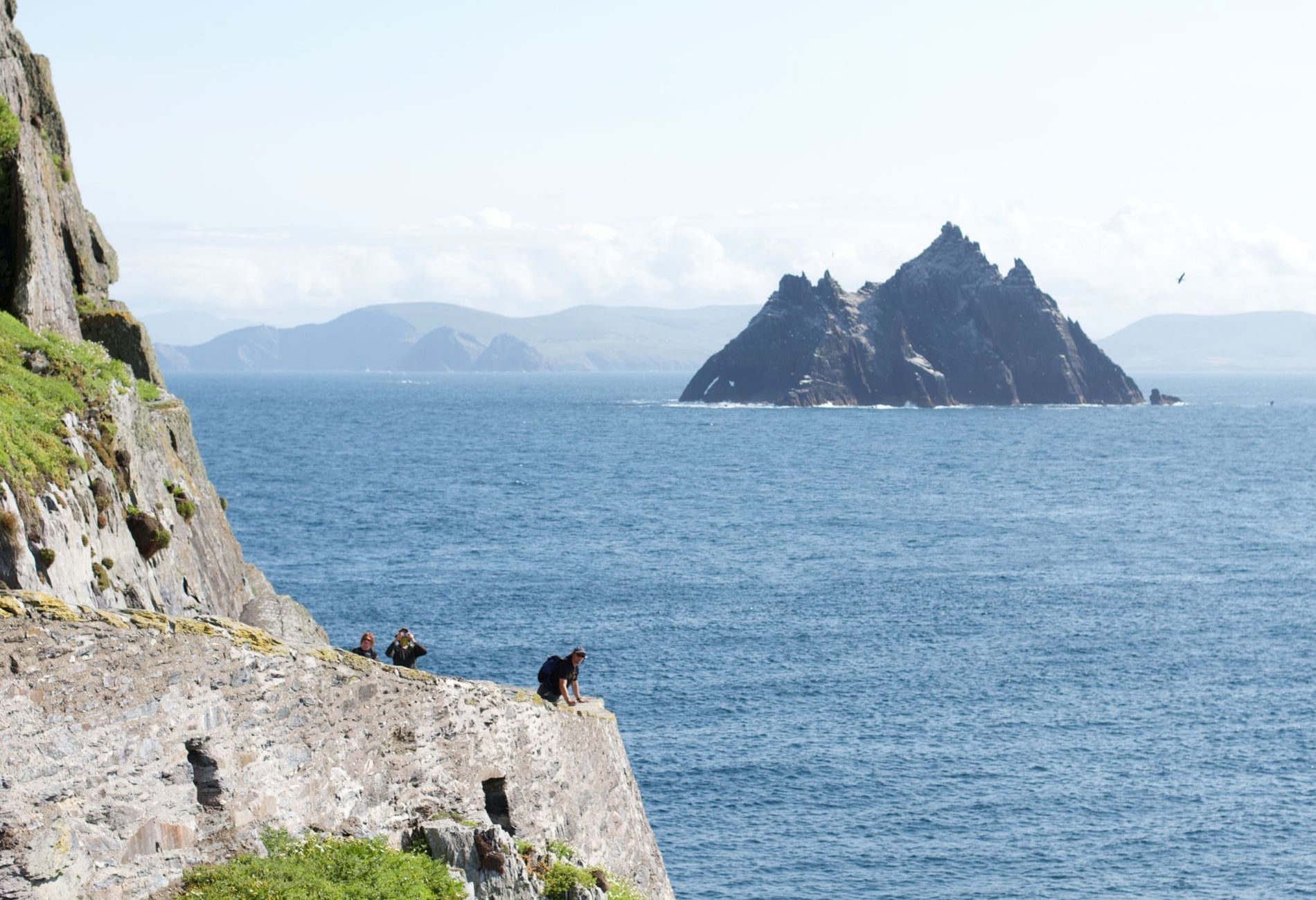 Skellig Michael viewed from a coastal path along Ireland's Atlantic shoreline
