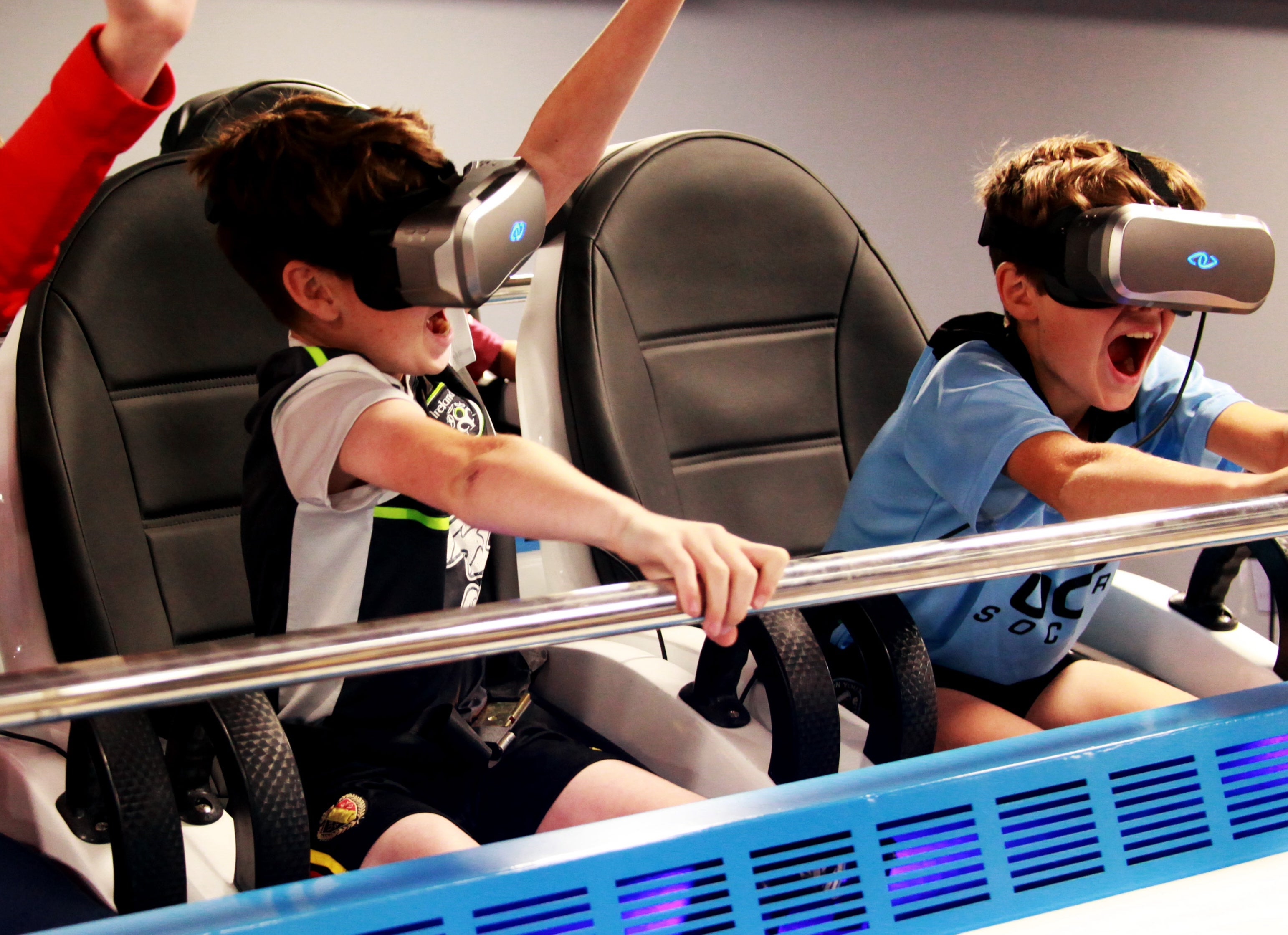 Kids using a VR headset at the Explorium.