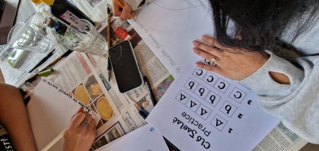 A person practicing calligraphy