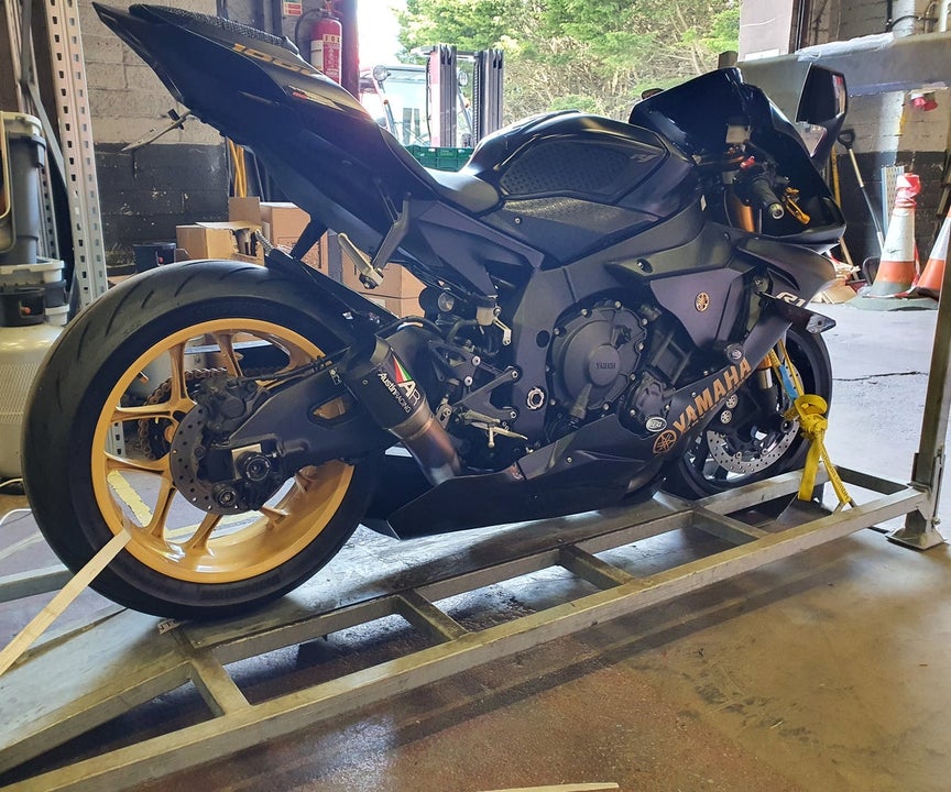 A Yamaha R1 motorcycle on the cradle arriving from Italy at Bike on Board