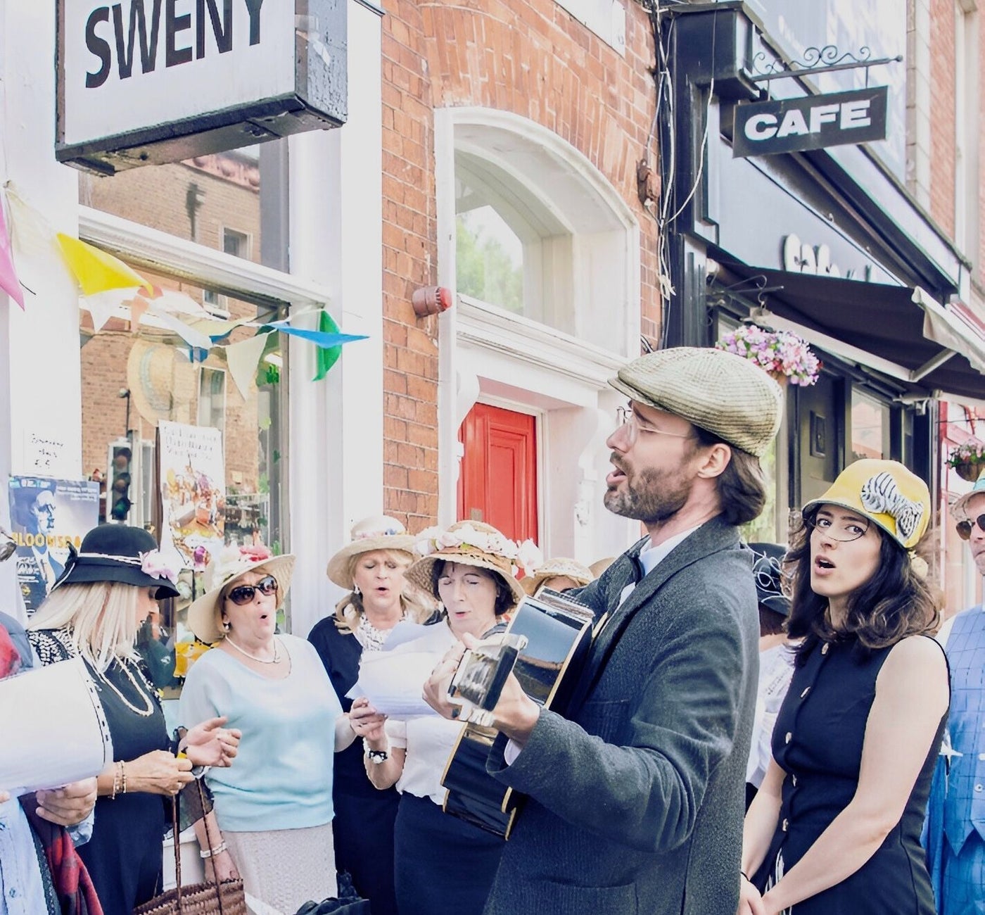 A group of people singing as part of a walking tour in Dublin City