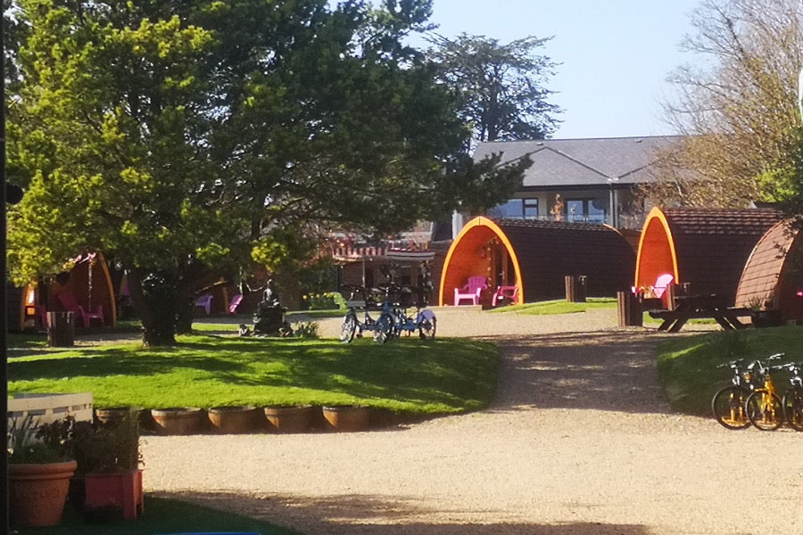 3 pods that open out onto a green area