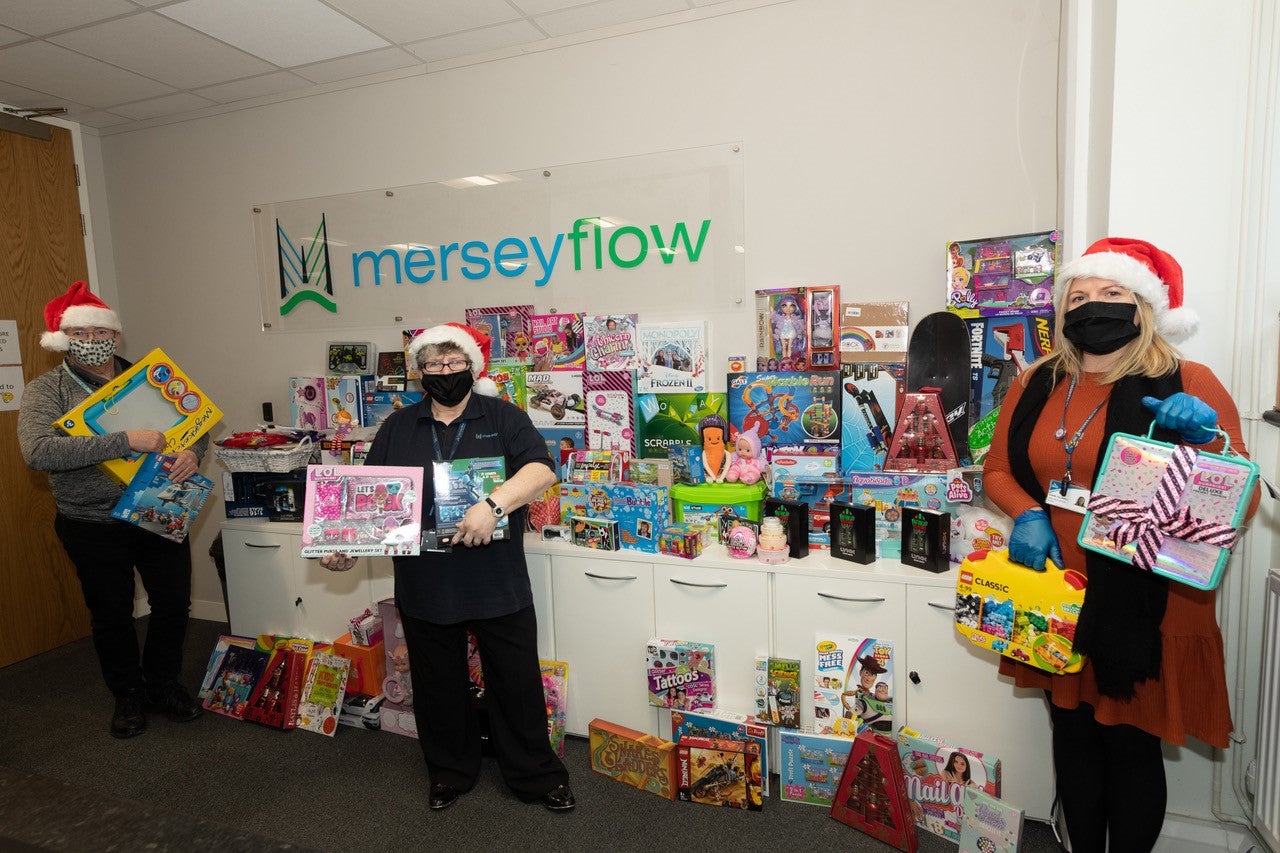 Merseyflow and Merseylink staff with donated Christmas gifts for Halton Children's Centres.