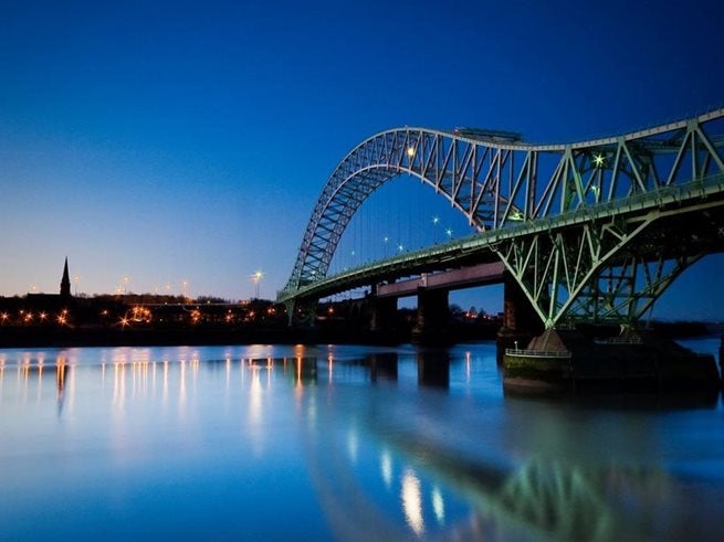 Silver Jubilee Bridge at night, reflecting on the River Mersey