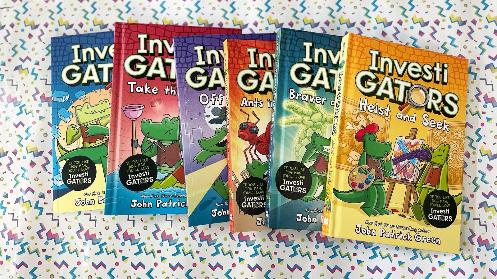 Six InvestiGators books fanned out on a cartoon background