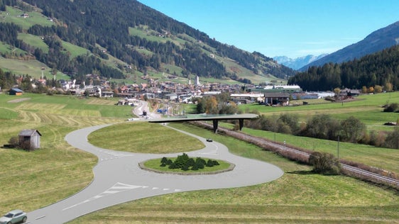 Il nuovo progetto per il sovrappasso ferroviario di San Candido si presenta in modo rispettoso del paesaggio con un ponte che potrebbe essere realizzato in tempi relativamente brevi con i contributi infrastrutturali dei fondi olimpici (Rendering: Dipartimento Mobilità)