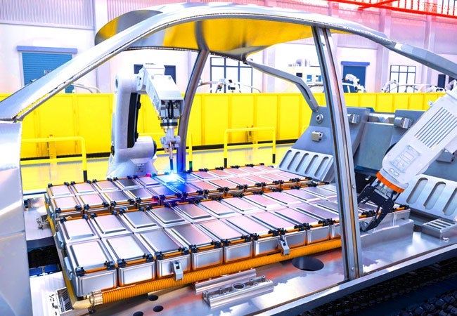 Electric vehicle battery being build by robots.