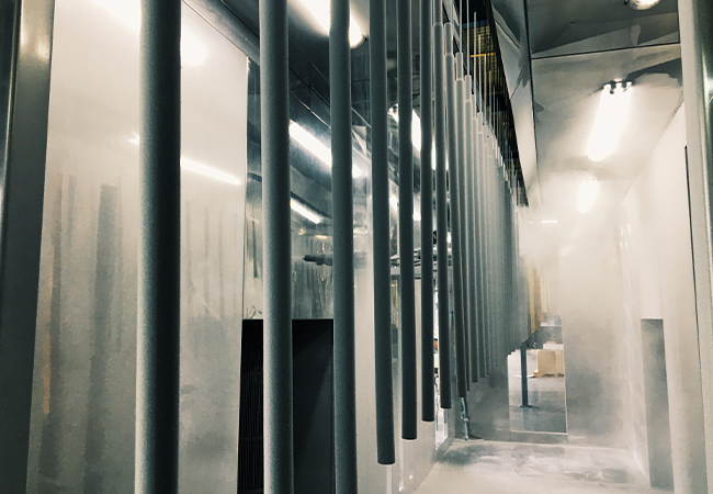 Appliance header image of Envirocron powder being sprayed onto a metal structure