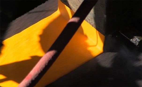 Coatings being applied to a roadway
