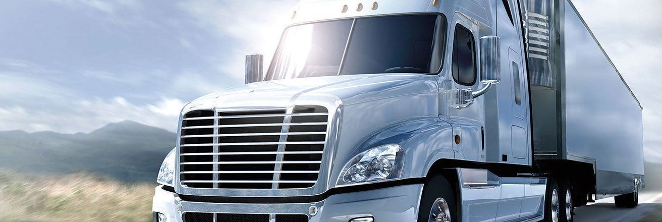 Truck driving along road