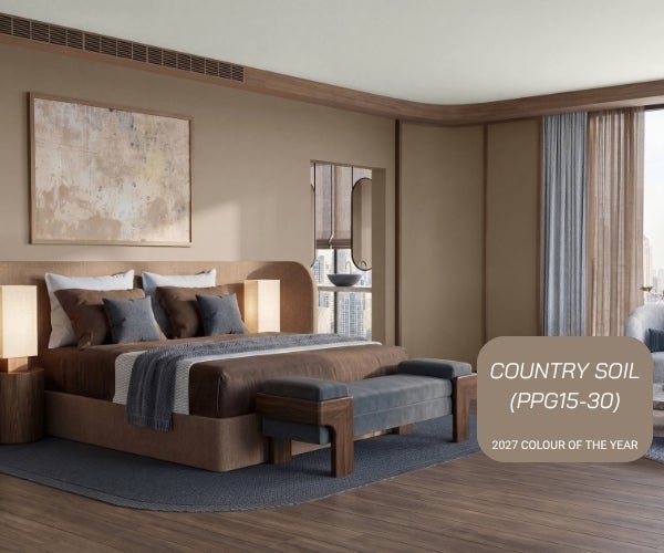 A bedroom with a bed and a bench