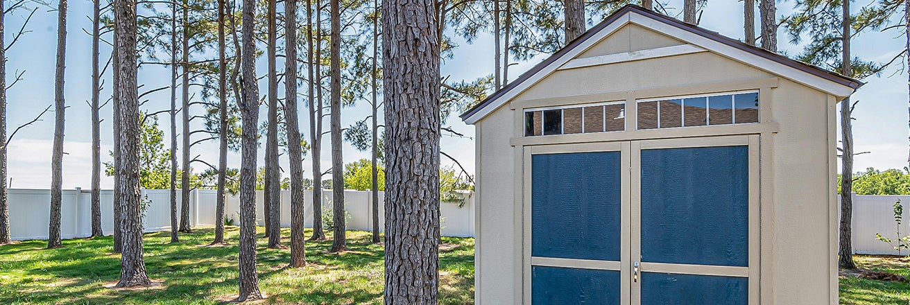 Large shed within trees