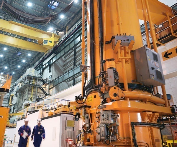 A large yellow machine in a factory