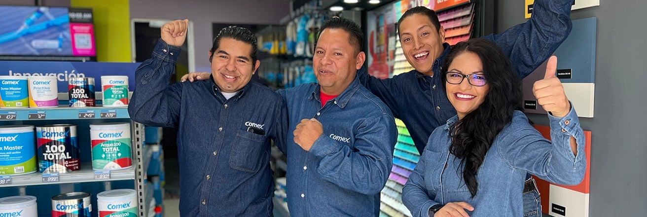 PPG team celebrating in store alongside products and swatches