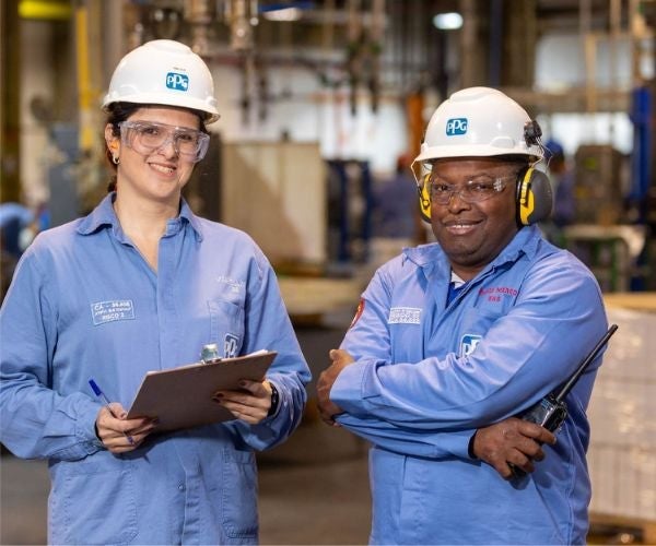 Two employees in a warehouse setting.