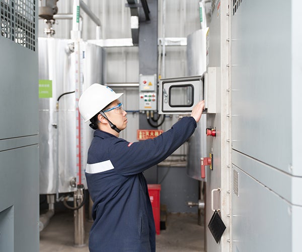 Engineer wearing safety equipment within plant