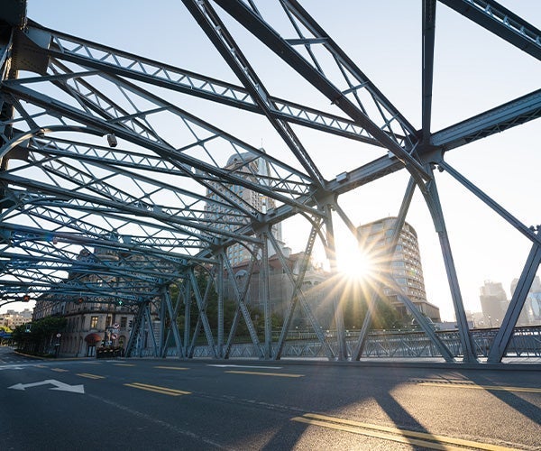 Metal trusses over a bridge deck