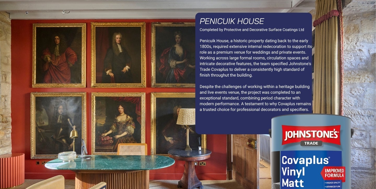 A room with a table and paintings on the wall