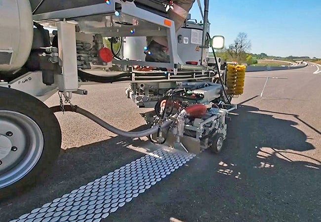 A road-marking equipment, applying Thermodrop, a thermoplastic marking material, to a road