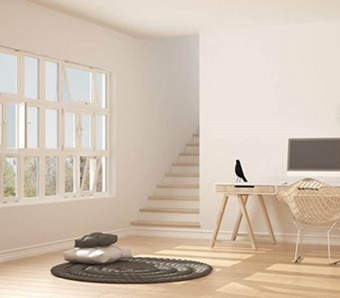 A room with a desk and a computer