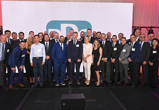 Julio Bueno, a PPG employee within our Automotive Refinish Coatings business, with his colleagues during an award ceremony