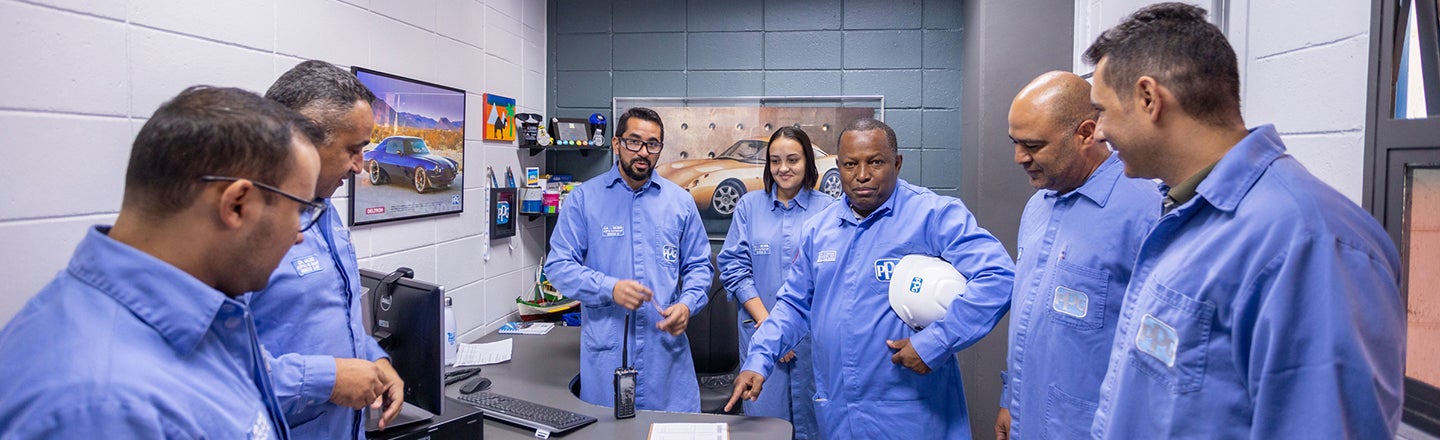 PPG team wearing PPE in discussion