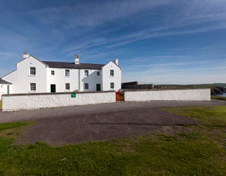 A white house with a driveway