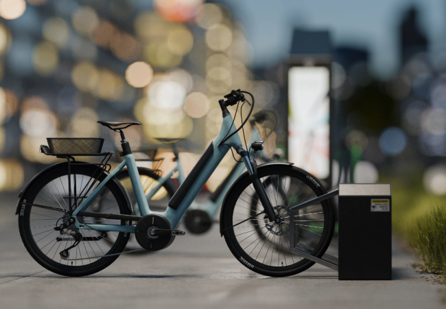 Blue e-bike charging outside with city behind