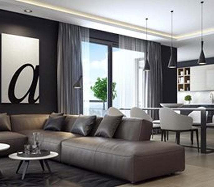 A living room with a couch and dining table