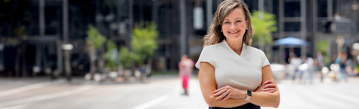 Maria Lamorey, a PPG employee within our Industrial Coatings business, in front of the PPG Place in Pittsburgh