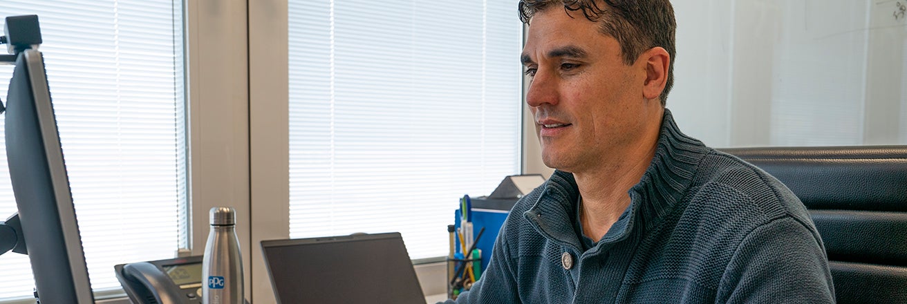 Male in office working on computer