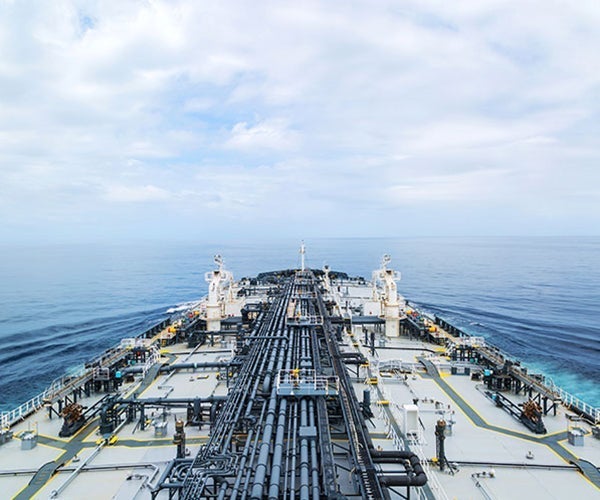 Large ship with pipework and deck covered in protective coatings