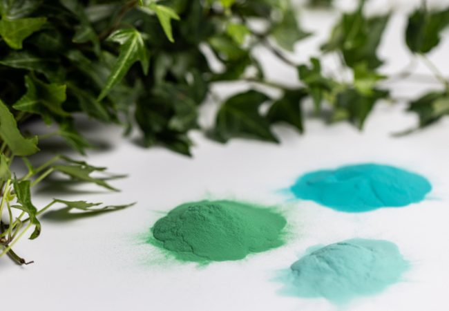 Envirocron Low Bake product card showing green plants and three shades of green powder against a white background