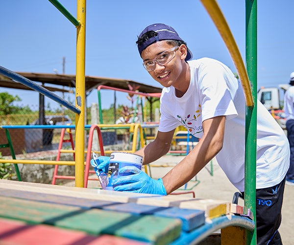 PPG volunteer painting as part of Colorful Communities project