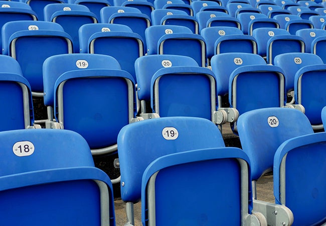 Blue stadium seats with metal frames