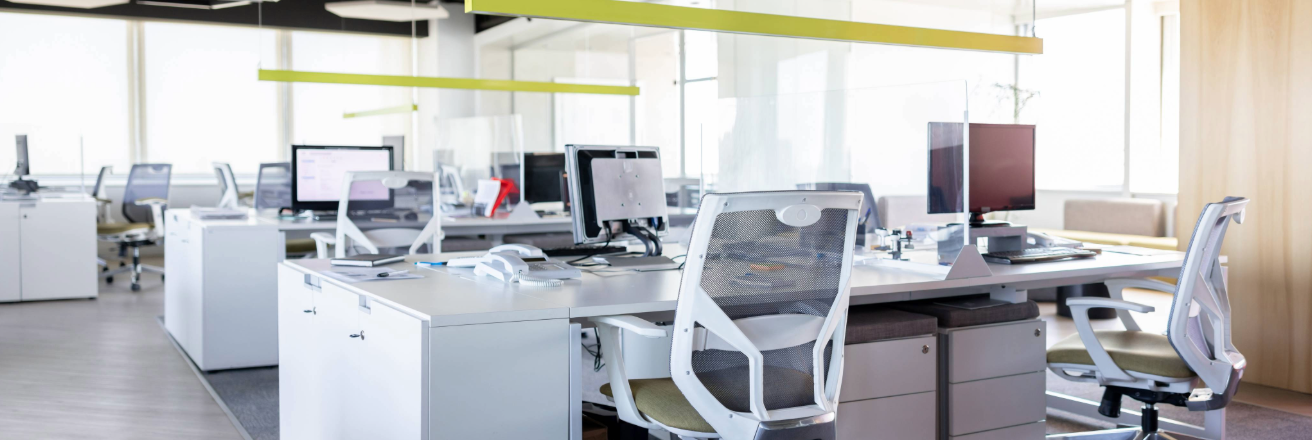 White office furniture including desks and office chairs