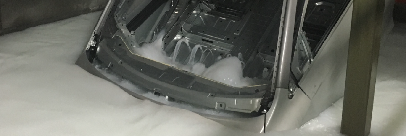 a vehicle body is dipped into a primer substance 